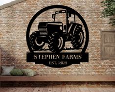 the personalized farm tractor sign is mounted on a brick wall next to a bench