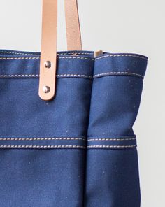 This versatile, fun tote is our best selling go-to for daily carry. Handmade in our Omaha, NE studio using only the finest materials. Tote Insert, Daily Carry, Canvas Leather Tote, Knitting Bag, Leather Luggage Tags, Omaha Nebraska, Duck Canvas, Veg Tan Leather, Leather Luggage