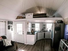 the kitchen is clean and ready to be used as a living room or dining area