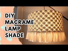 a lamp shade that is hanging on the wall with text overlay reading diy macrame lamp shade