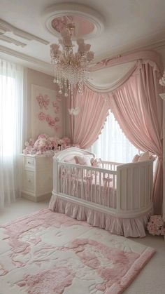 a baby's room with pink curtains, crib and chandelier in the corner