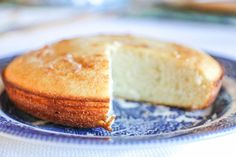 a piece of cake on a blue and white plate with a bite taken out of it