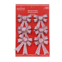 pink glitter bows on red background