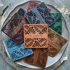 the coasters are made out of wood and have laser cut designs on each side