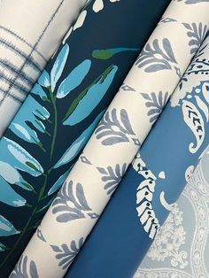 four different types of wallpapers with blue and white designs on them, all lined up together