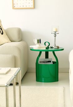 a living room with a couch, chair and table in the corner on carpeted floor