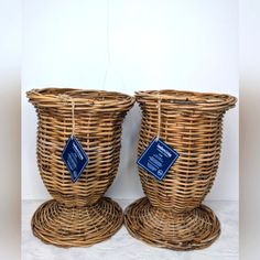 two wicker baskets with labels on them