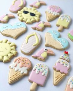 some decorated cookies are laying on a table