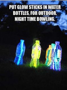 three glowing bottles sitting in the grass with text that reads put glow sticks in water bottles, for outdoor night time bowling