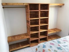 a bedroom with a bed and wooden shelves