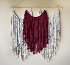 two red and white fringes hanging on a wall