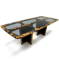 an art deco dining table with black and gold marbled top, in the style of person