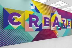 a large colorful wall with the word creativity painted on it