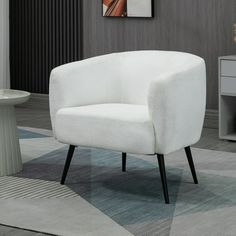 a white chair sitting on top of a carpeted floor