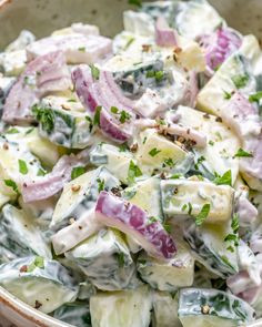 a bowl filled with potato salad and dressing