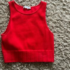 Never Worn. Perfect Condition Red Sleeveless Winter Tops, Red Fitted Crop Top For Winter, Red Ribbed Crop Top For Summer, Fitted Red Crop Top For Winter, Red Fitted Crew Neck Crop Top, Casual Red Tops With Ribbed Neckline, Fitted Red Knit Top For Fall, Red Ribbed Sleeveless Crop Top, Red Ribbed Fitted Crop Top