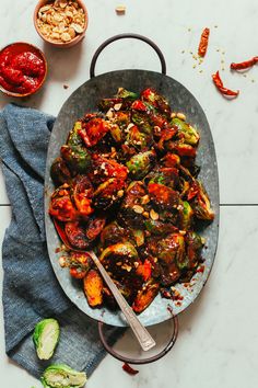 a pan filled with cooked vegetables on top of a table