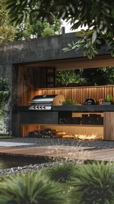 an outdoor bbq and grill area in the middle of a garden with plants growing on it