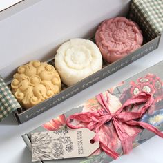 three different types of soaps in a box