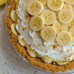 a pie topped with bananas and whipped cream