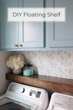 a washer and dryer sitting next to each other in a room with blue cabinets