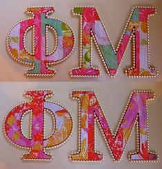 the letters are decorated with flowers and beads