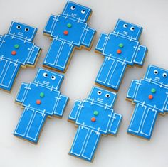 cookies decorated to look like robots are on a table