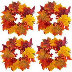 four autumn wreaths with leaves and berries arranged in the shape of a letter o