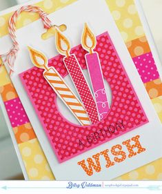 a birthday card with candles on it and the words wish written in orange, pink, and white