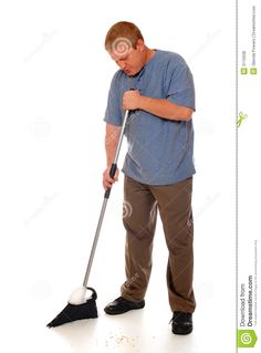 a man is cleaning the floor with a mop stock photo - image 34987