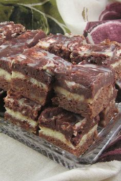 there are many pieces of cake on the glass plate