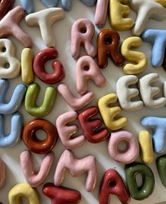 the letters are made out of plastic doughnuts