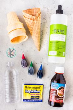 ingredients to make an ice cream sundae laid out on a white counter top,