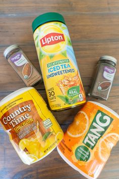 yogurt, orange juice and nut butter on a wooden table