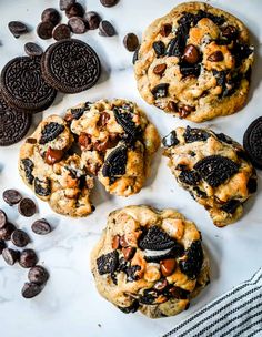 cookies and chocolate chips on a white surface