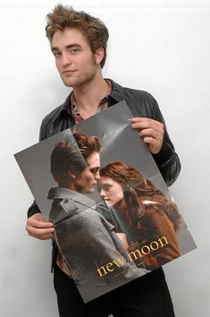 a man holding up two pictures of the twilight saga