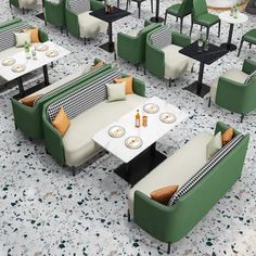 an outdoor seating area with green and white chairs, black and white checkered tablecloth