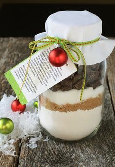 a mason jar filled with cookies, milk and chocolate chips for christmas or new year's eve