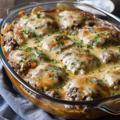 a casserole dish filled with meat and cheese