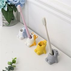 Description: By keeping your toothbrush clean and dry, keeping it upright and within reach, and with its very cute animal shape, this toothbrush holder will liven up your bathroom cabinet and make your kids love brushing their teeth. Very practical, this toothbrush holder is easy to clean because the surface is very smooth and very durable and delicate because of the high quality material used. It is made of high quality resin material. There are 4 different sizes for you to choose. This toothbr Desktop Gadgets, Bathroom Countertop Organizer, Tooth Brush Holder, Toothbrush Accessories, Toothbrush Holders, Toothbrush Storage, Creative Bathroom, Countertop Organizer, Bathroom Toothbrush Holder