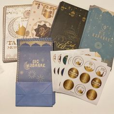 there are many different types of cards and envelopes on the table with each one