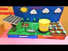 a cake made to look like a solar power station with trees, grass and dirt