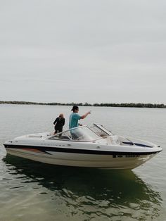 two people on a boat in the water