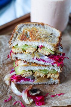 a sandwich cut in half sitting on top of a table