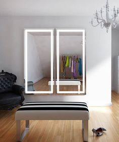 a room with a bench, mirror and chandelier on the wall next to it