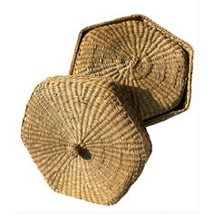 two wicker baskets sitting on top of each other in front of a white background