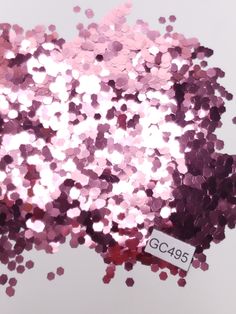 pink and purple confetti sprinkles on white background