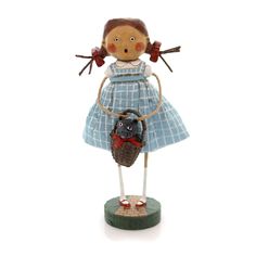 a figurine is holding a basket with an animal in it's hand