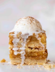 a piece of cake with icing sitting on top of it's crusts