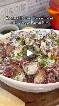 potato salad with crispy bacon bits in a white bowl